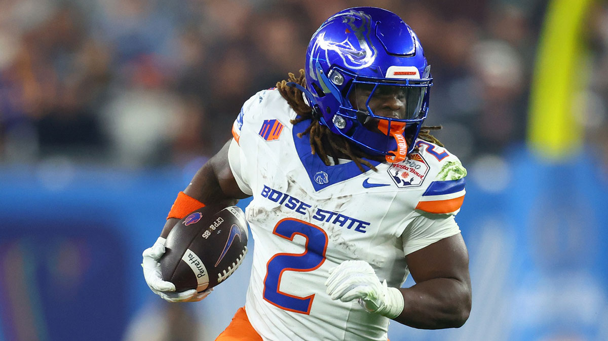 Dec 31, 2024; Glendale, AZ, USA; Boise State Broncos running back Ashton Jeanty (2) rushes the ball against the Penn State Nittany Lions during the first half in the Fiesta Bowl at State Farm Stadium. Mandatory Credit: Mark J. Rebilas-Imagn Images