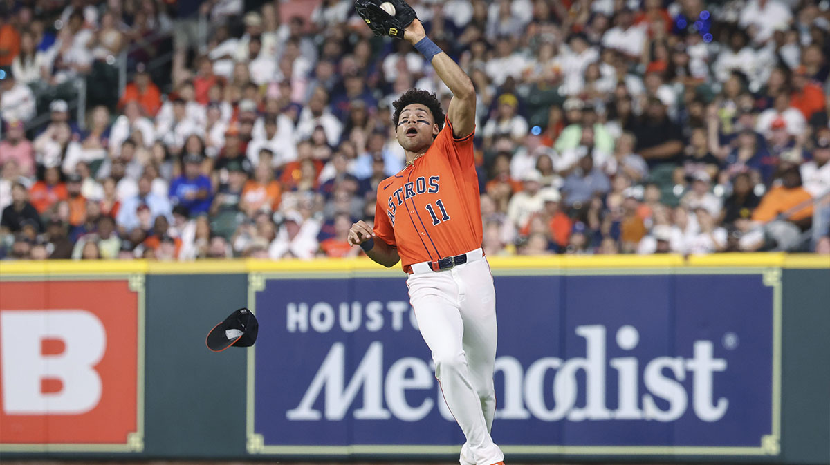 Houston Astros right fielder Cam Smith (11) catches a fly ball during the sixth inning against the San Diego Padres at Daikin Park.