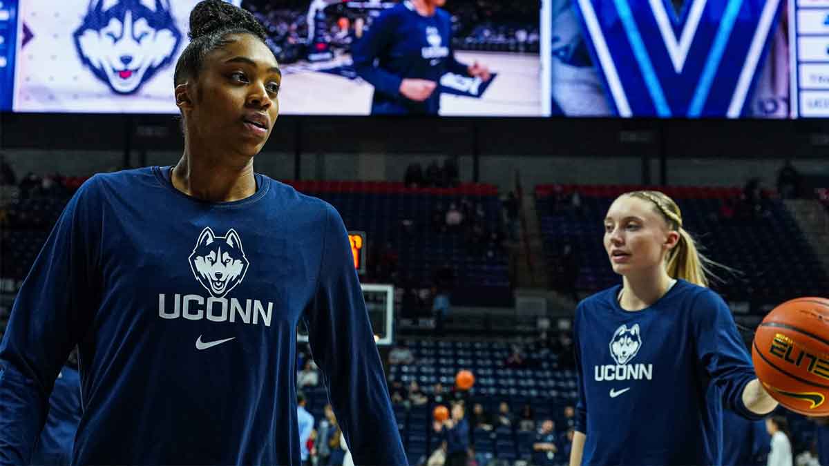 UConn Huskies forward Aubrey Griffin (44) and guard Paige Bueckers (5) warm up before the start of the game against the Villanova Wildcats at Harry A. Gampel Pavilion.