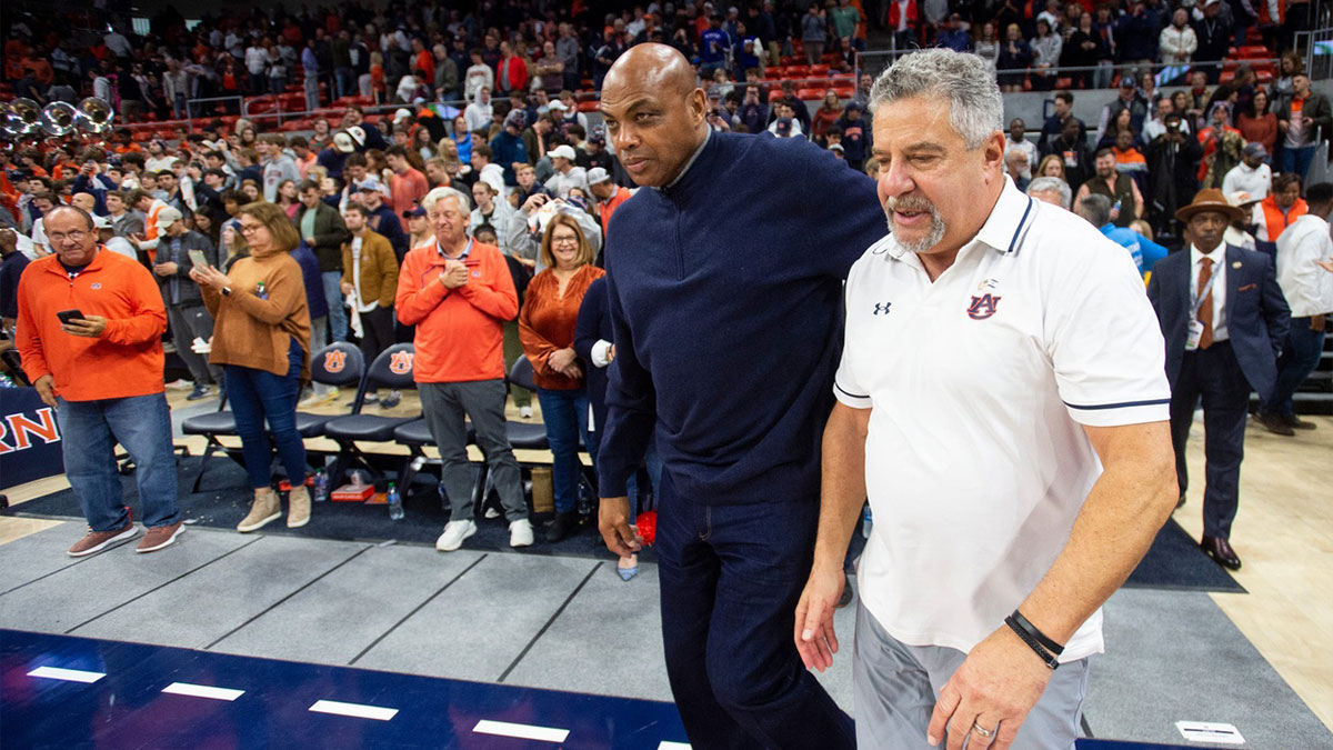 Former Auburn basketball player Charles Barkley and Auburn Tigers head coach Bruce Pearl take the court after the game as Auburn Tigers take on USC Trojans at Neville Arena in Auburn, Ala., on Sunday, Dec. 17, 2023. Auburn Tigers defeated USC Trojans 91-75.
