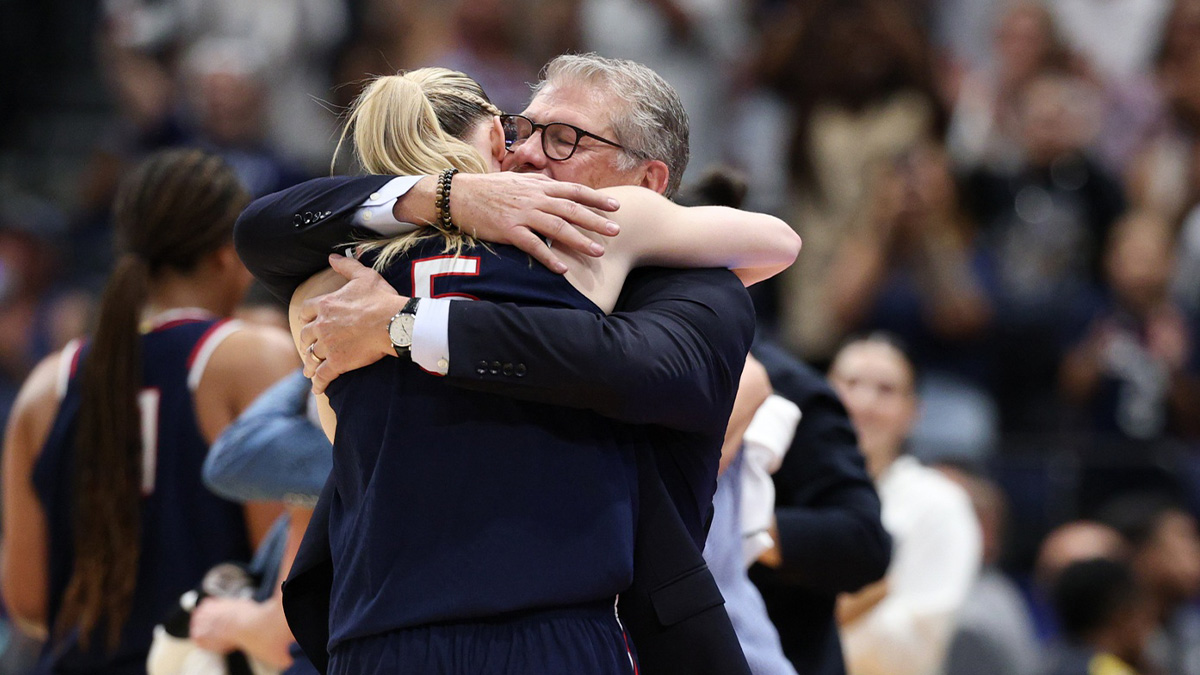 UConn Huskies head coach Geno Auriemma hugs guard Paige Bueckers (5) during the second half against the South Carolina Gamecocks of the national championship of the women's 2025 NCAA tournament at Amalie Arena.