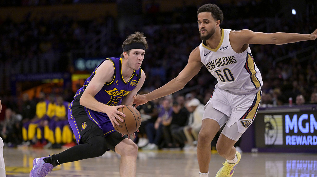 Los Angeles Lakers guard Austin Reaves (15) is defended by New Orleans Pelicans forward Jeremiah Robinson-Earl (50) as he drives to the basket in the first half at Crypto.com Arena.