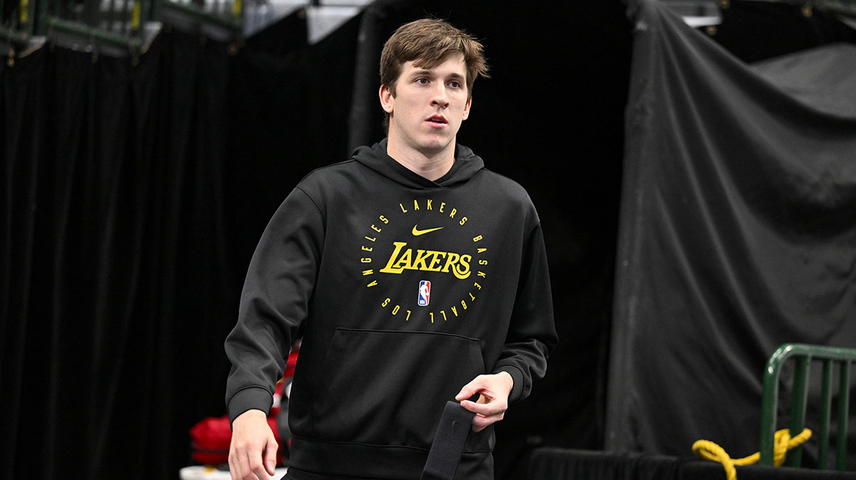 Los Angeles Lakers guard Austin Reaves (15) walks on to the court before the game between the Dallas Mavericks and the Los Angeles Lakers during the first quarter at the American Airlines Center.