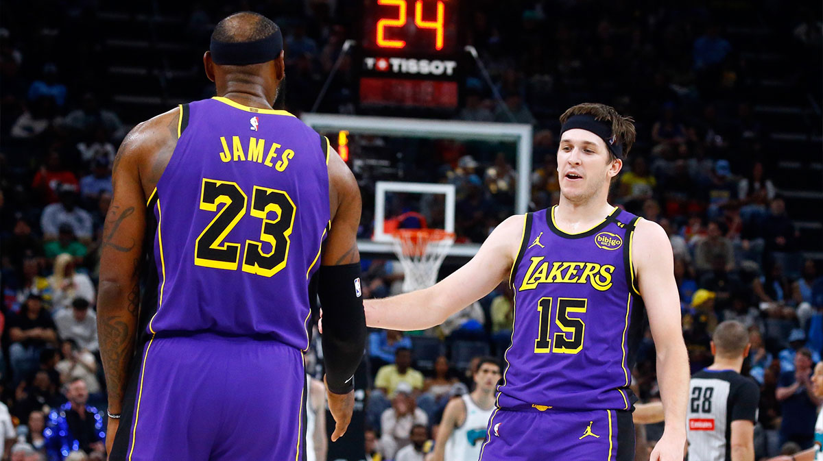 Los Angeles Lakers guard Austin Reaves (15) reacts with forward LeBron James (23) during the second quarter against the Memphis Grizzlies at FedExForum.