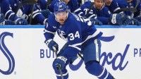 Toronto Maple Leafs center Auston Matthews (34) skates with the puck against the Washington Capitals during the third period at Scotiabank Arena.