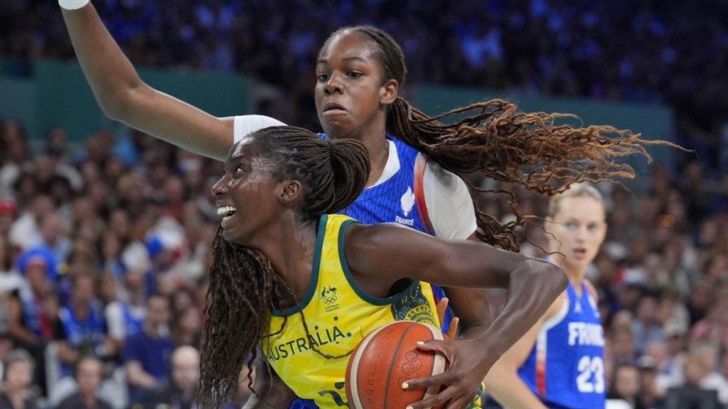 Australia forward Ezi Magbegor (13) controls the ball against France centre Dominique Malonga (14) in the second half in a women’s group B game during the Paris 2024 Olympic Summer Games.
