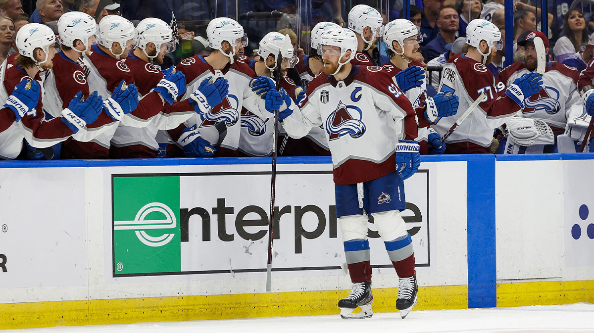 Colorado Avalanche left wing Gabriel Landeskog (92) is congratulated by teammates after scoring against the Tampa Bay Lightning during the second period in game three of the 2022 Stanley Cup Final at Amalie Arena.