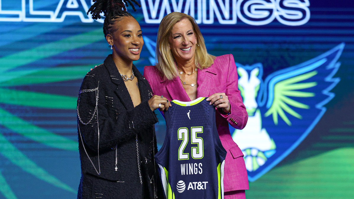 Aziaha James poses with WNBA commissioner Cathy Engelbert after being selected with the number twelve overall pick to the Dallas Wings in the 2025 WNBA Draft at The Shed at Hudson Yards.