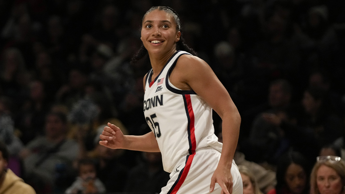 Connecticut Huskies guard Azzi Fudd (35) reacts after scoring a three pointer during the first half against the Louisville Cardinals at Barclays Center.