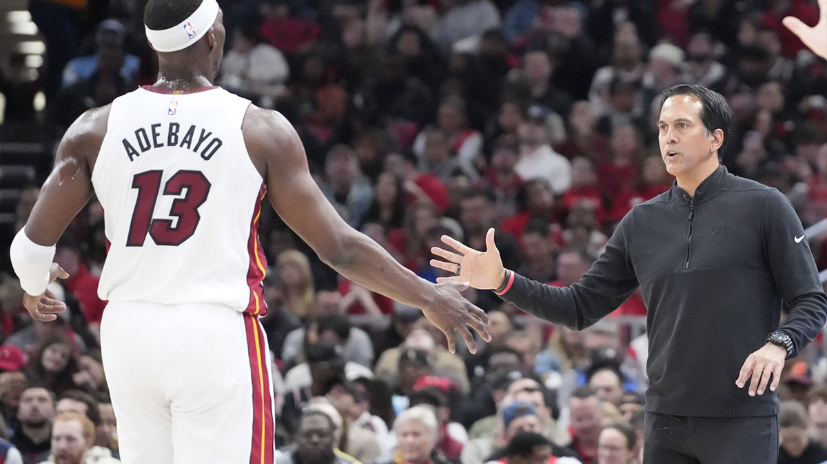 Miami Heat head coach Erik Spoelstra shakes hands with center Bam Adebayo (13) during the first quarter at United Center.