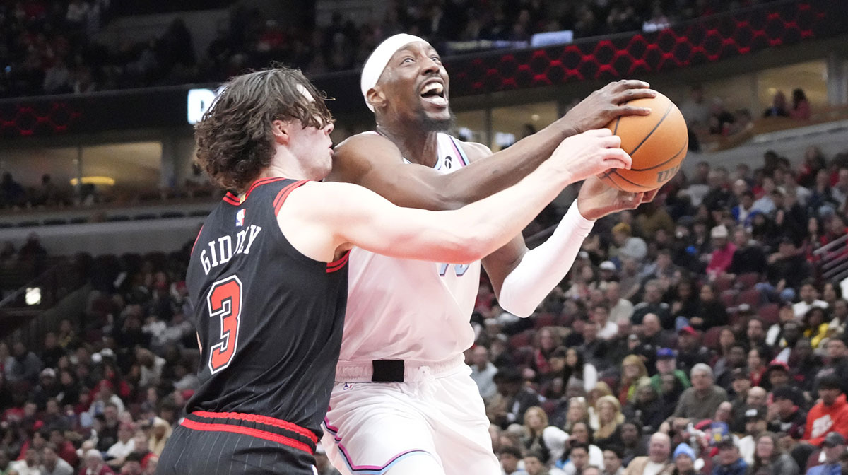 Chicago Bulls guard Josh Giddey (3) defends Miami Heat center Bam Adebayo (13) during the second half at United Center.