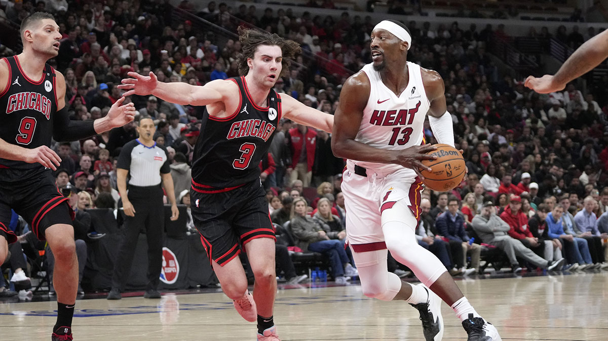 Chicago Bulls guard Josh Giddey (3) defends Miami Heat center Bam Adebayo (13) during the second half at United Center.