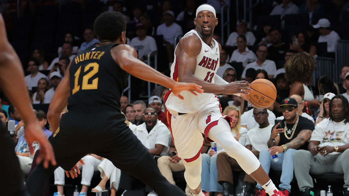 Miami Heat center Bam Adebayo (13) drives to the basket against Cleveland Cavaliers forward De'Andre Hunter (12) in the third quarter during game three for the first round of the 2025 NBA Playoffs at Kaseya Center.