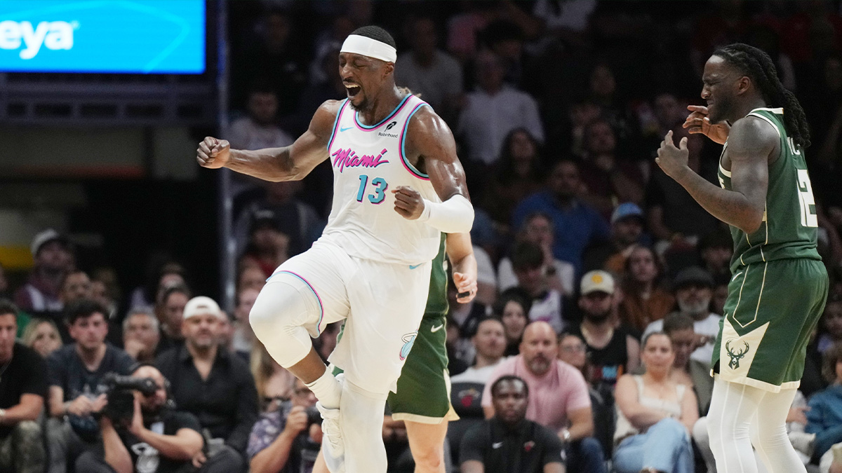 Miami Heat center Bam Adebayo (13) celebrates a shot made over Milwaukee Bucks forward Taurean Prince (12) during the second half at Kaseya Center.