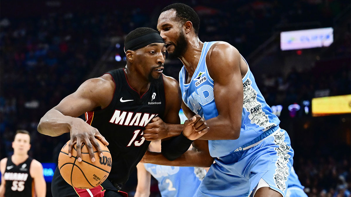 Miami Heat center Bam Adebayo (13) drives to the basket against Cleveland Cavaliers forward Evan Mobley (4) during the first half at Rocket Arena.