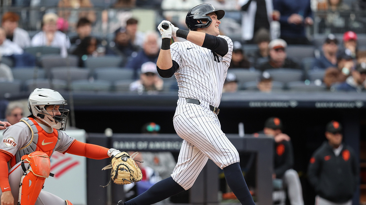 New York Yankees designated hitter Ben Rice (22) hits an RBI single in the second inning against the San Francisco Giants at Yankee Stadium.