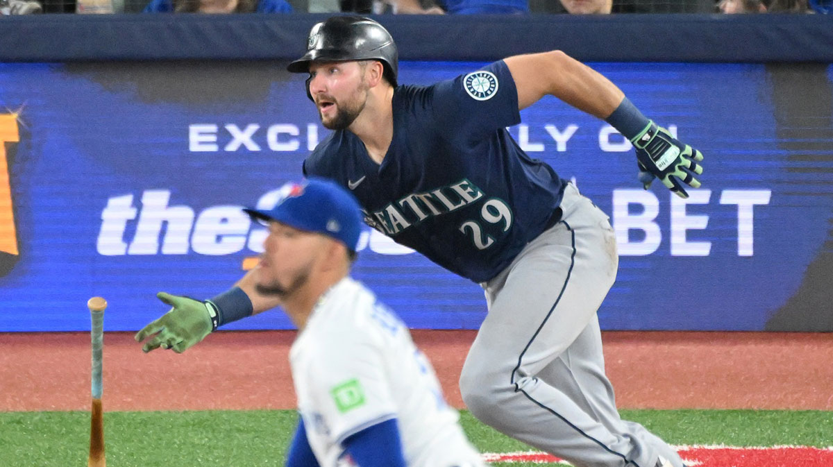 Apr 19, 2025; Toronto, Ontario, CAN; Seattle Mariners catcher Cal Raleigh (29) hits a double off of Toronto Blue Jays pitcher Jose Berrios (17) in the fifth inning at Rogers Centre.