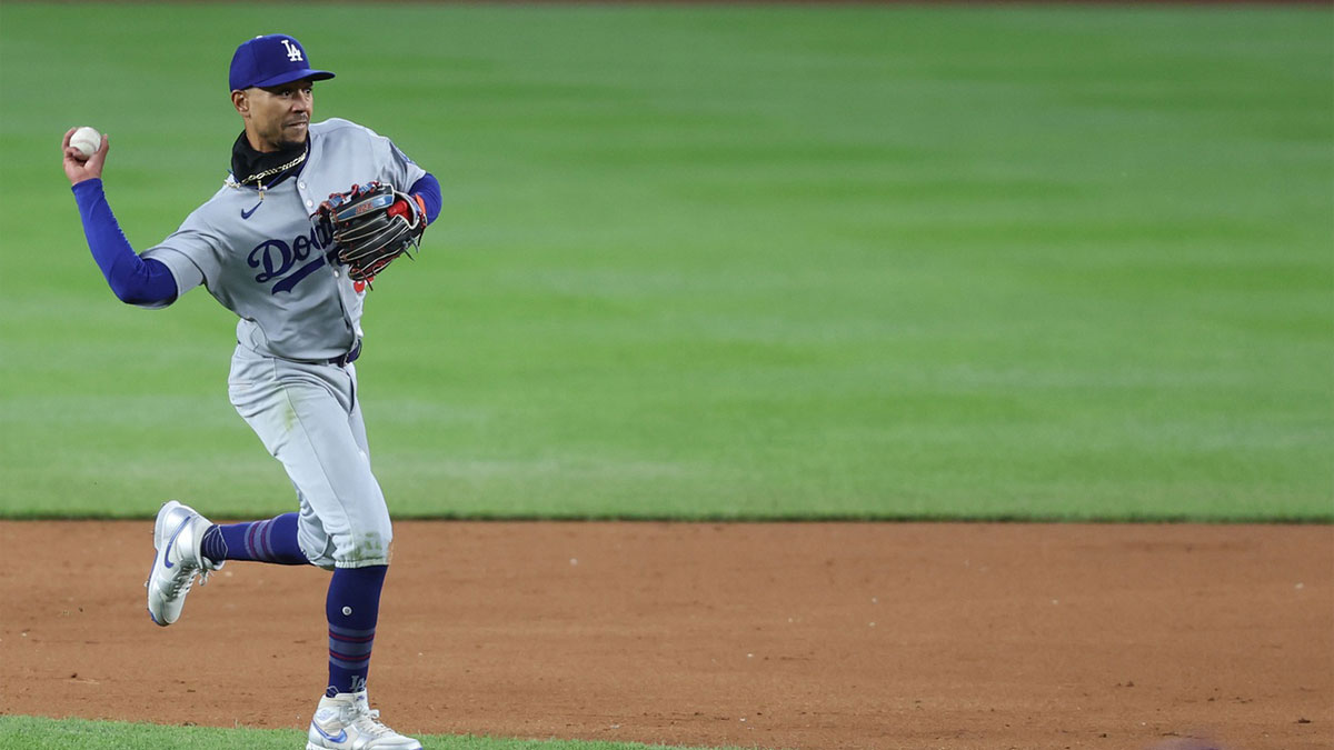 Los Angeles Dodgers shortstop Mookie Betts (50) makes a throw to first base on a ball hit by Washington Nationals catcher Keibert Ruiz (bot pictured) at Nationals Park