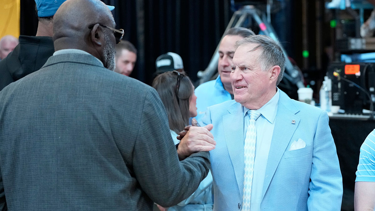 Former North Carolina Tar Heels great Lawrence Taylor with head football coach Bill Bellichick together during a time out in the first half at Dean E. Smith Center. Mandatory Credit: Bob Donnan-Imagn Images