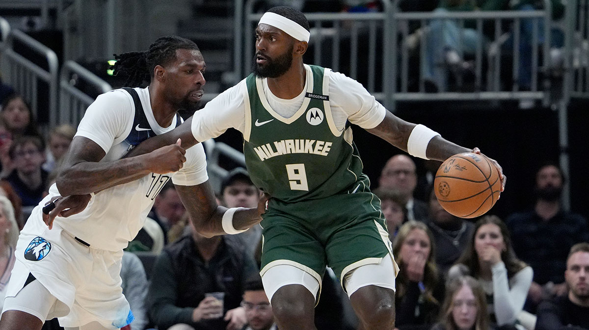Milwaukee Bucks forward Bobby Portis (9) drives against Minnesota Timberwolves center Naz Reid (11) in the first half at Fiserv Forum.