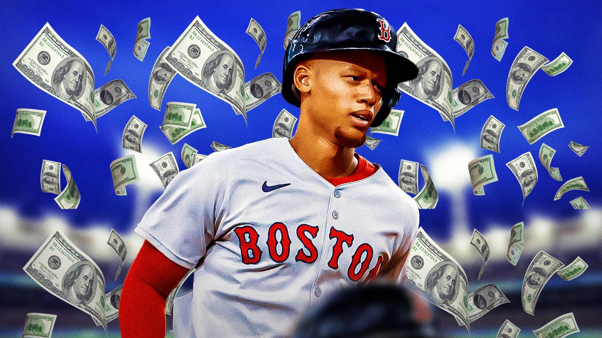 Kristian Campbell with a bunch of money falling around him