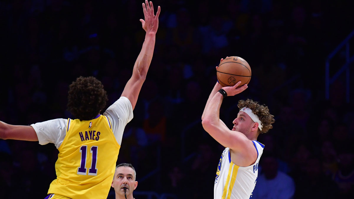 Golden State Warriors guard Brandin Podziemski (2) shoots against Los Angeles Lakers center Jaxson Hayes (11) during the first half at Crypto.com Arena.