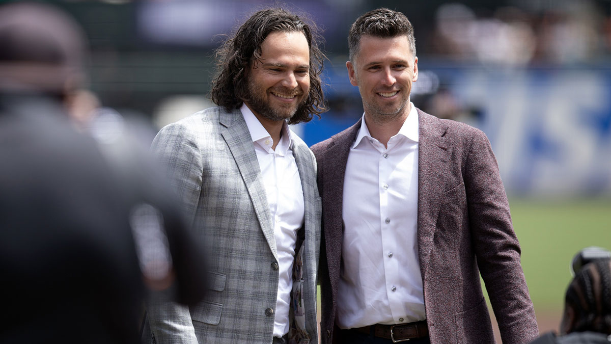 Former San Francisco Giants shortstop Brandon Crawford (left) poses for a photograph Giants president of baseball operations Buster Posey following a ceremony to honor his legacy with the team before a game against the Texas Rangers at Oracle Park.