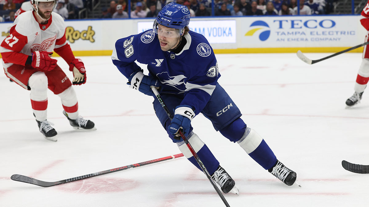 Tampa Bay Lightning left wing Brandon Hagel (38) skates with the puck as Detroit Red Wings center Michael Rasmussen (27) defends during the first period at Amalie Arena