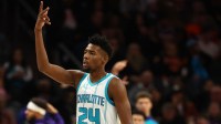 Charlotte Hornets forward Brandon Miller (24) reacts after making a basket against the Phoenix Suns during the second half at Footprint Center
