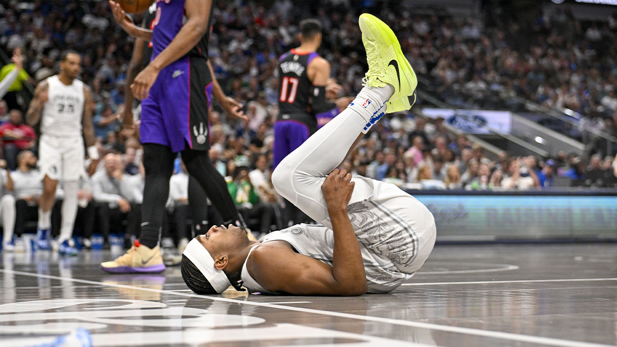 Dallas Mavericks guard Brandon Williams (10) falls to the floor during the second half against the Toronto Raptors at the American Airlines Center.