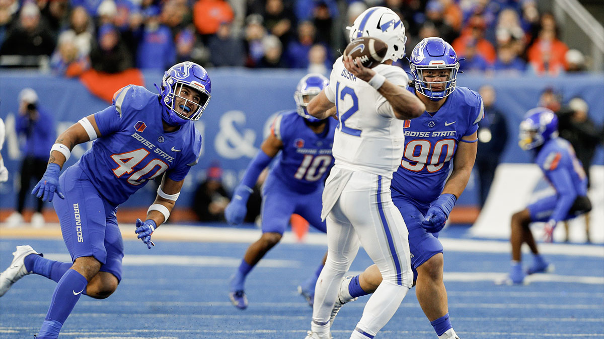 Boise State Broncos defensive end Jayden Virgin (40) and defensive tackle Braxton Fely (90) pressure Air Force Falcons quarterback John Busha (12) during the second half at Albertsons Stadium. Boise State defeats Air Force 27-19.
