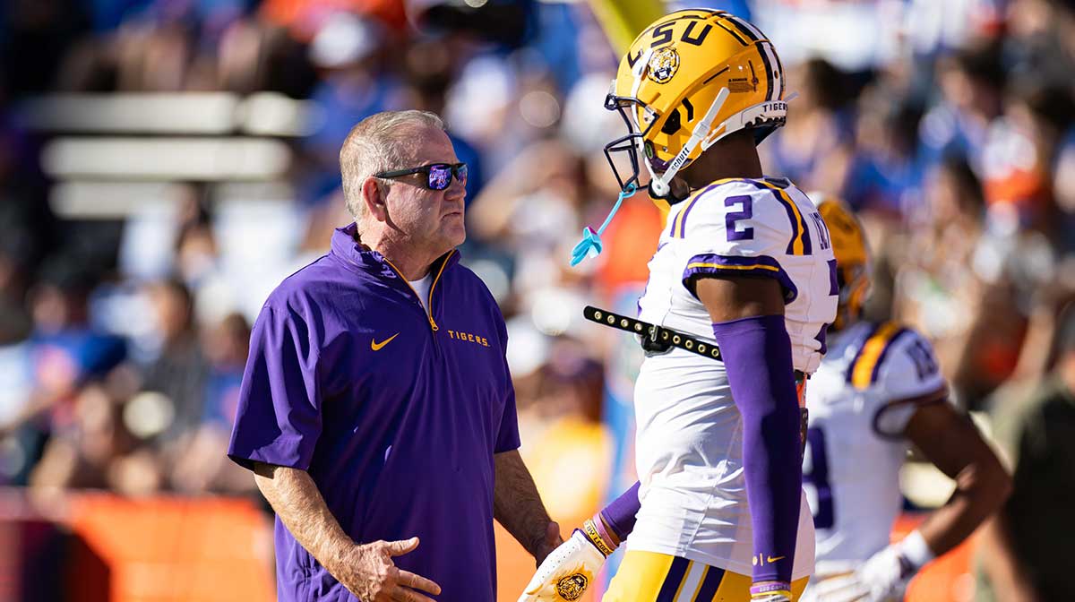 Brian Kelly talking to Kyren Lacy, whose death was discussed by his former coach, before the LSU Tigers' football game against Florida on November 16, 2024.