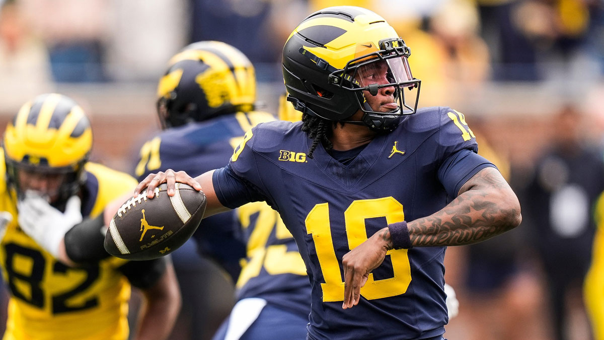 Team Blue quarterback Bryce Underwood (19) makes a pass against Team Maize during the first half of the spring game at Michigan Stadium