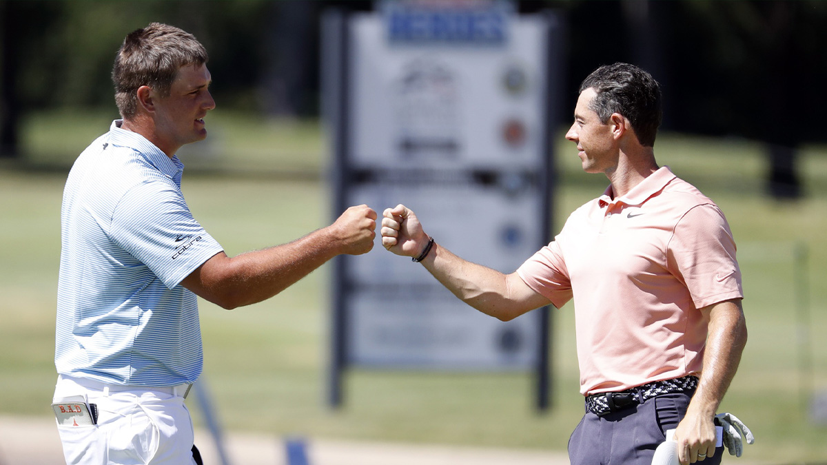 Bryson DeChambeau and Rory McIlroy fist bump on the 18th green during the final round of the Charles Schwab Challenge golf tournament at Colonial Country Club.