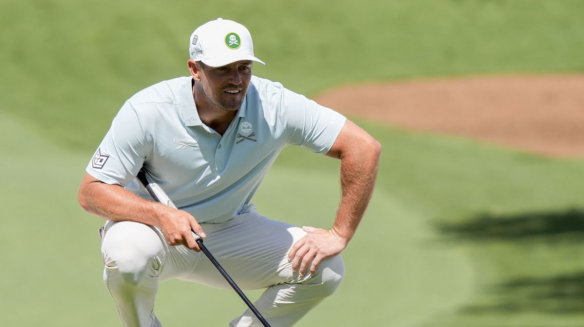 Bryson DeChambeau lines up his putt on the no. 7 green during the second round of the Masters Tournament at Augusta National Golf Club.