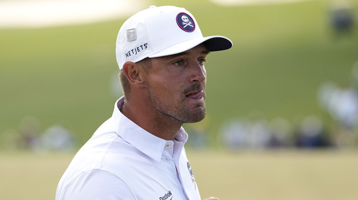Bryson DeChambeau reacts after putting on the ninth green during the third round of the Masters Tournament at Augusta National Golf Club.