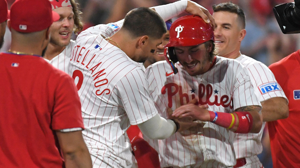 Philadelphia Phillies second base Bryson Stott (5) celebrates with outfielder Nick Castellanos (8) after scoring the winning run on a wild pitch during the ninth inning against the Washington Nationals at Citizens Bank Park.