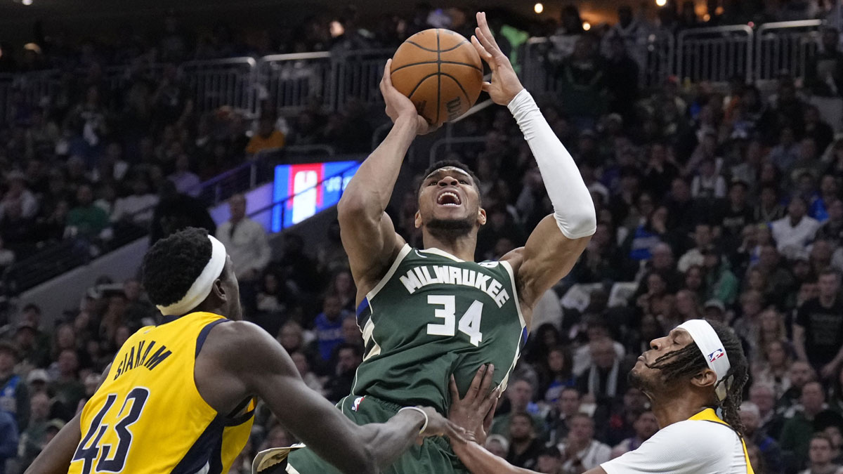 Bucks forward Giannis Antetokounmpo (34) puts up a shot against Indiana Pacers forward Pascal Siakam (43) and Indiana Pacers center Myles Turner (33) in the second half during game three of first round for the 2024 NBA Playoffs at Fiserv Forum next to Bucks guard Gary Trent Jr.