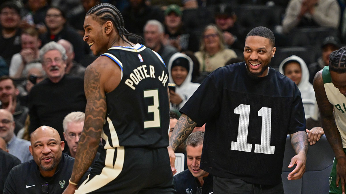 Bucks guard Damian Lillard (right) celebrates with guard Kevin Porter (3) after a score in the fourth quarter against the New Orleans Pelicans at Fiserv Forum