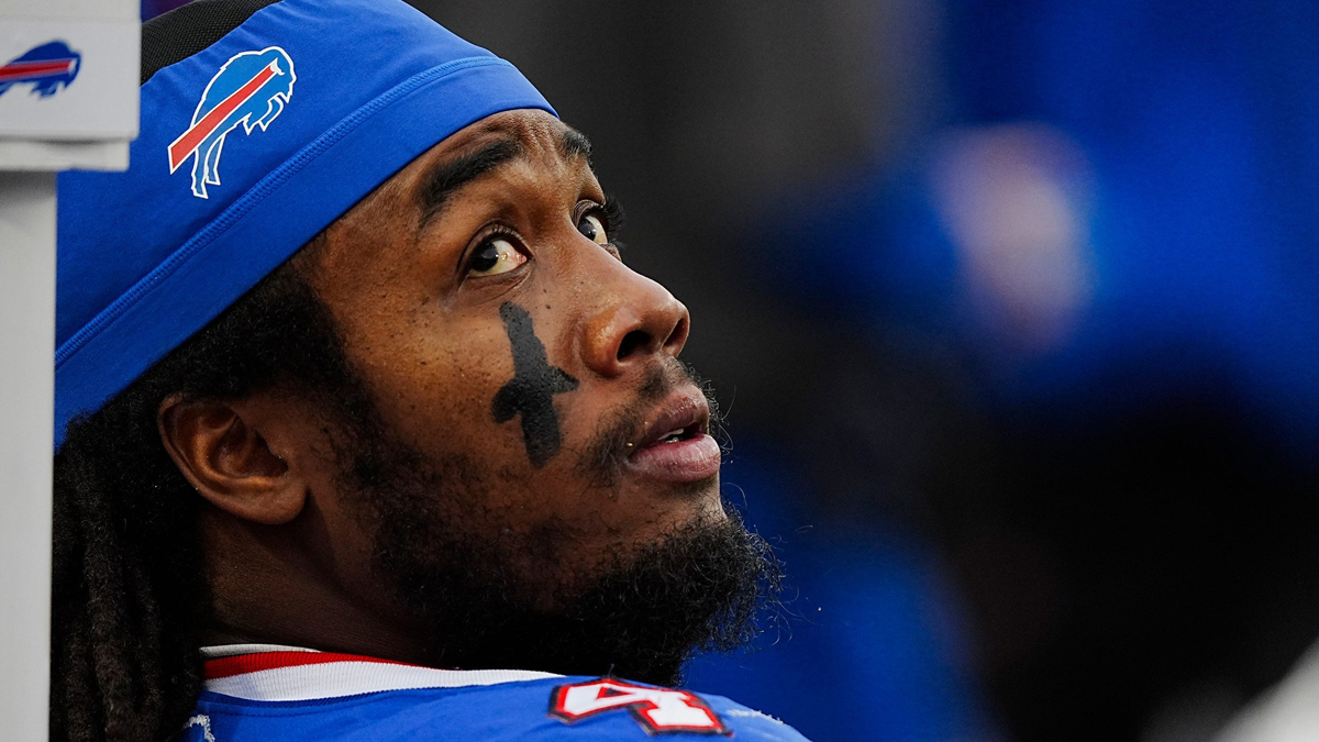 Buffalo Bills running back James Cook (4) takes a breather while the defensive line is on the field during second half of the Bills home game against the New York Jets at Highmark Stadium in Orchard Park