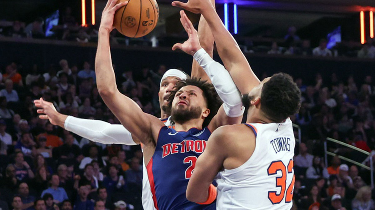 Detroit Pistons guard Cade Cunningham (2) looks to drive past New York Knicks guard Josh Hart (3) and center Karl-Anthony Towns (32) in Game One of the First Round of the NBA Playoffs at Madison Square Garden.