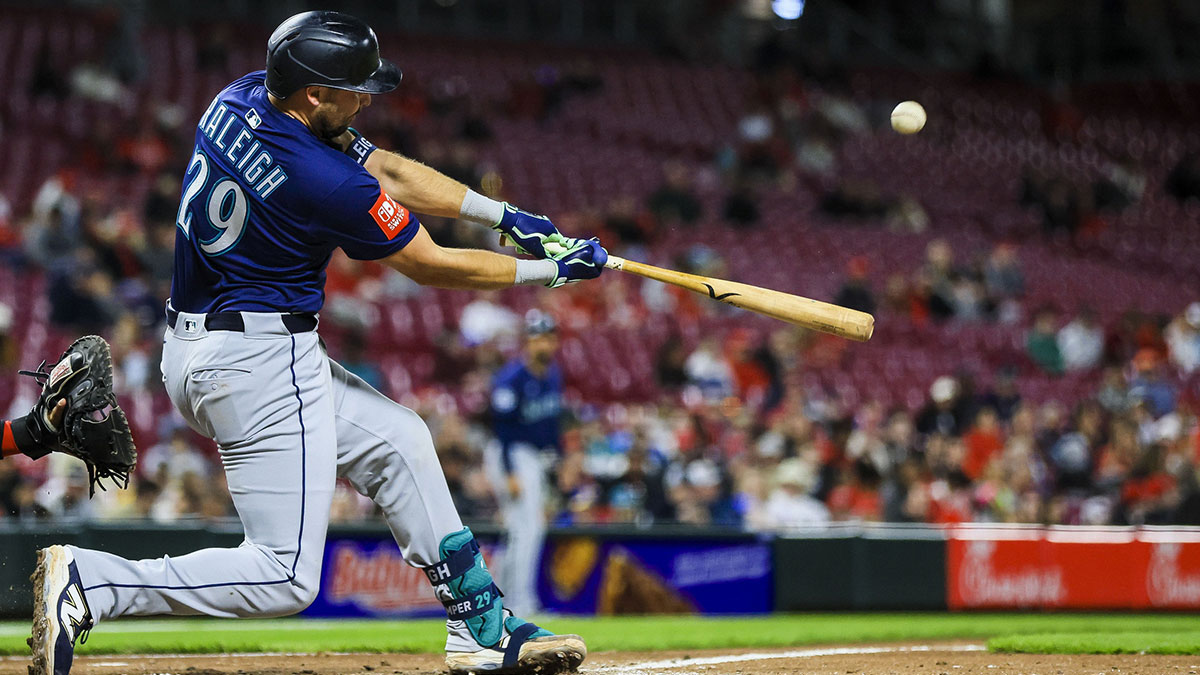 Seattle Mariners catcher Cal Raleigh (29) hits a solo home run in the seventh inning against the Cincinnati Reds at Great American Ball Park.
