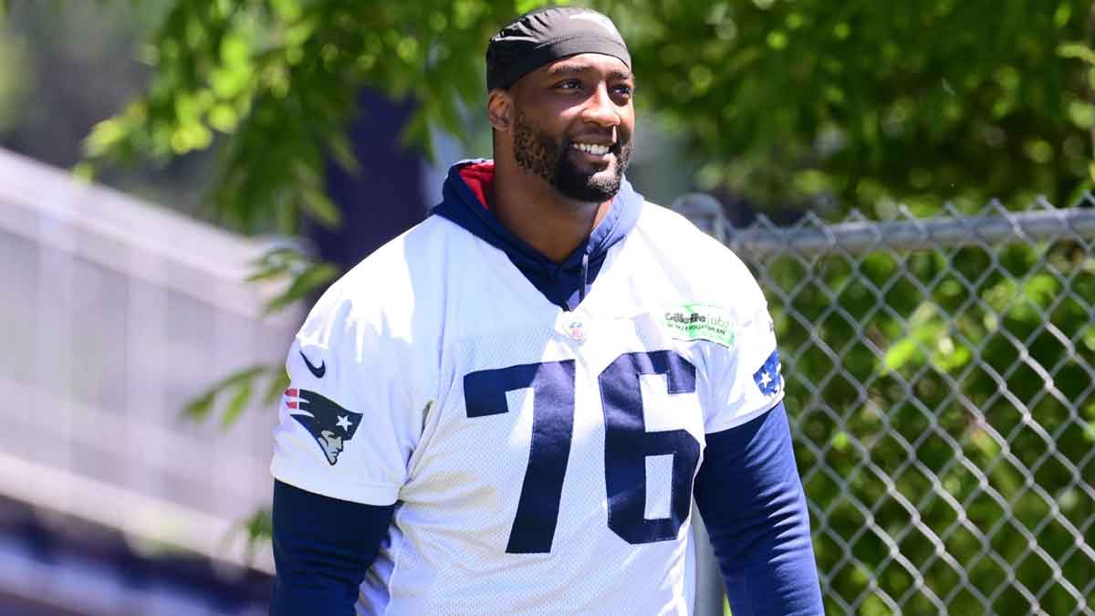 Jun 10, 2024; Foxborough, MA, USA; New England Patriots offensive tackle Calvin Anderson (76) walks to the practice fields for minicamp at Gillette Stadium. Mandatory Credit: Eric Canha-Imagn Images