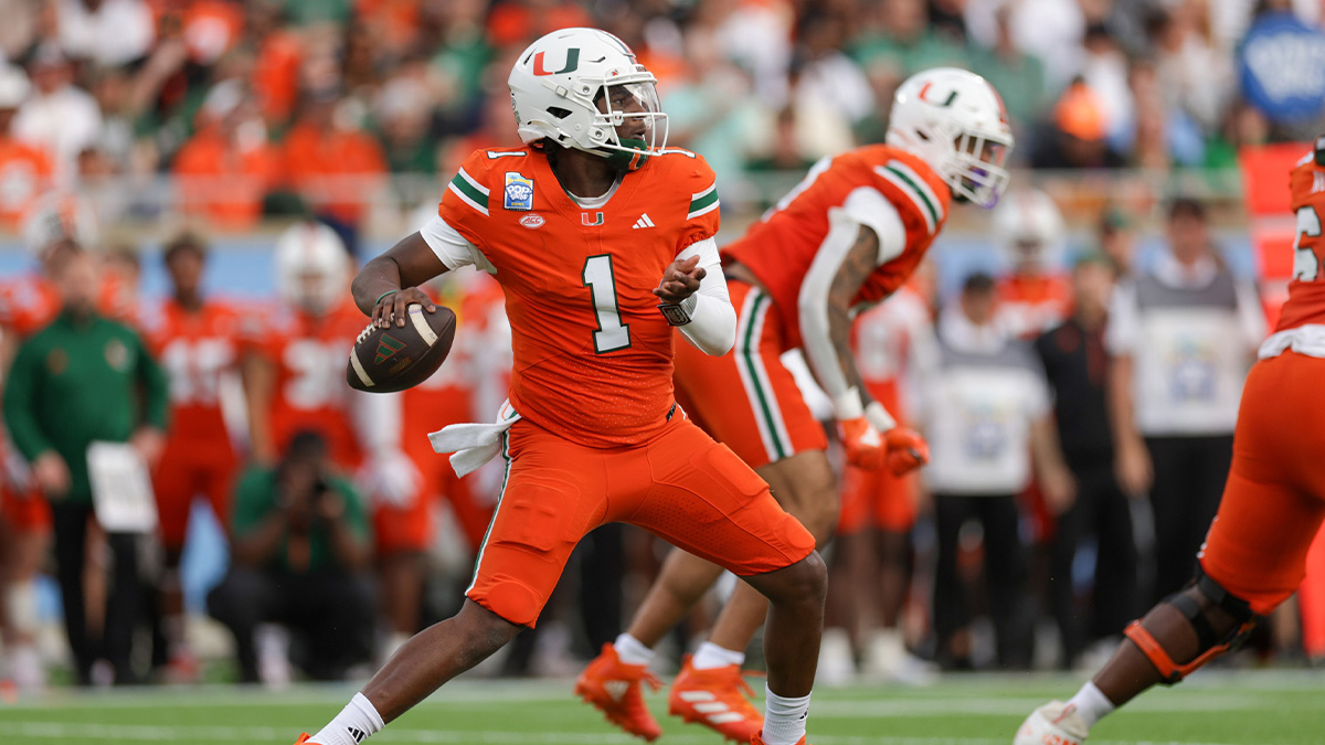 Miami Hurricanes quarterback Cam Ward (1) drops back to pass against the Iowa State Cyclones in the first quarter during the Pop Tarts bowl at Camping World Stadium.