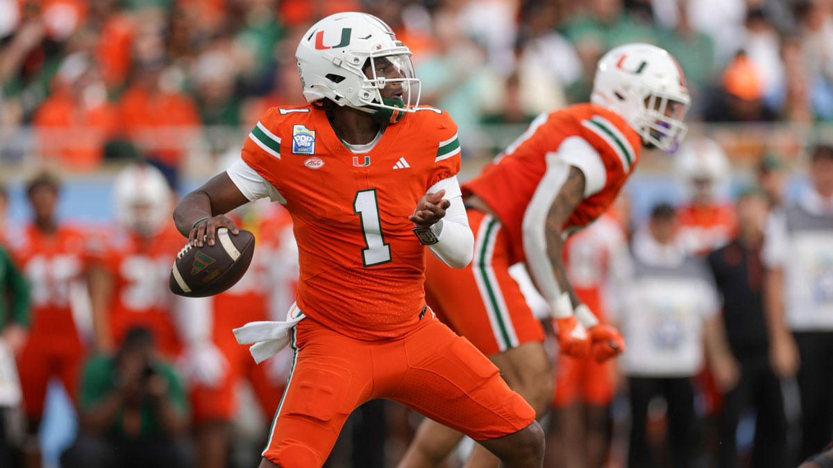 Miami Hurricanes quarterback Cam Ward (1) drops back to pass against the Iowa State Cyclones in the first quarter during the Pop Tarts bowl at Camping World Stadium