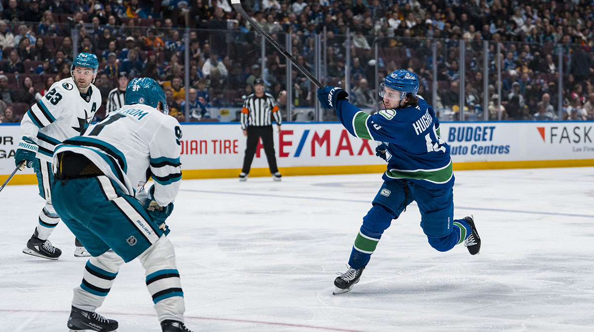 Vancouver Canucks defenseman Quinn Hughes (43) shoots against the San Jose Sharks in the second period at Rogers Arena.