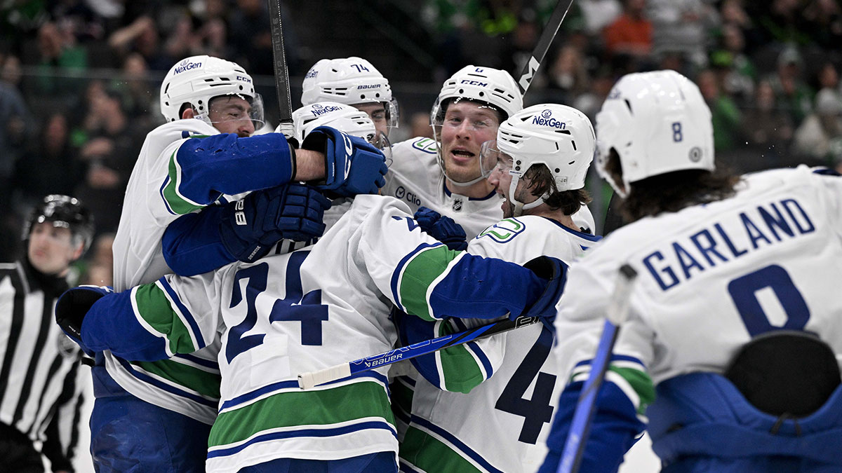 Vancouver Canucks left wing Jake DeBrusk (74) and center Pius Suter (24) and right wing Brock Boeser (6) and right wing Conor Garland (8) and defenseman Filip Hronek (17) and defenseman Quinn Hughes (43) celebrates the game tying goal scored by Suter against the Dallas Stars during the third period at the American Airlines Center.