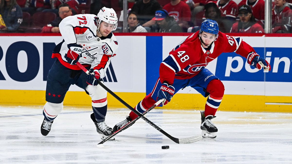 Washington Capitals left wing Anthony Beauvillier (72) plays the puck against Montreal Canadiens defenseman Lane Hutson (48) during the second period in game four of the first round of the 2025 Stanley Cup Playoffs at Bell Centre.