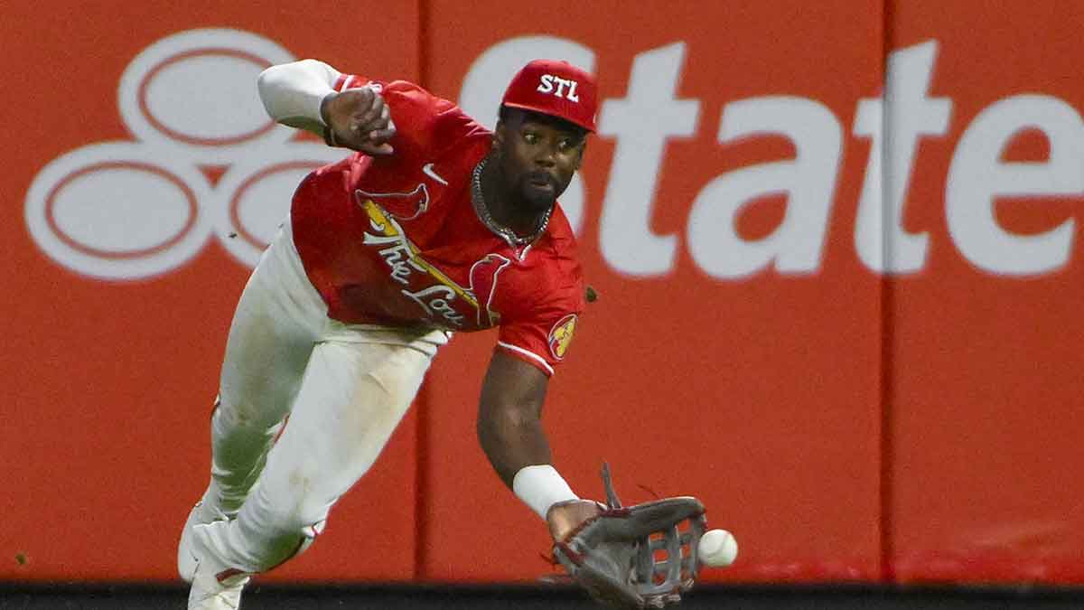 St. Louis Cardinals right fielder Jordan Walker (18) dives but is unable to catch a single by Milwaukee Brewers left fielder Jackson Chourio (not pictured) during the eighth inning at Busch Stadium.