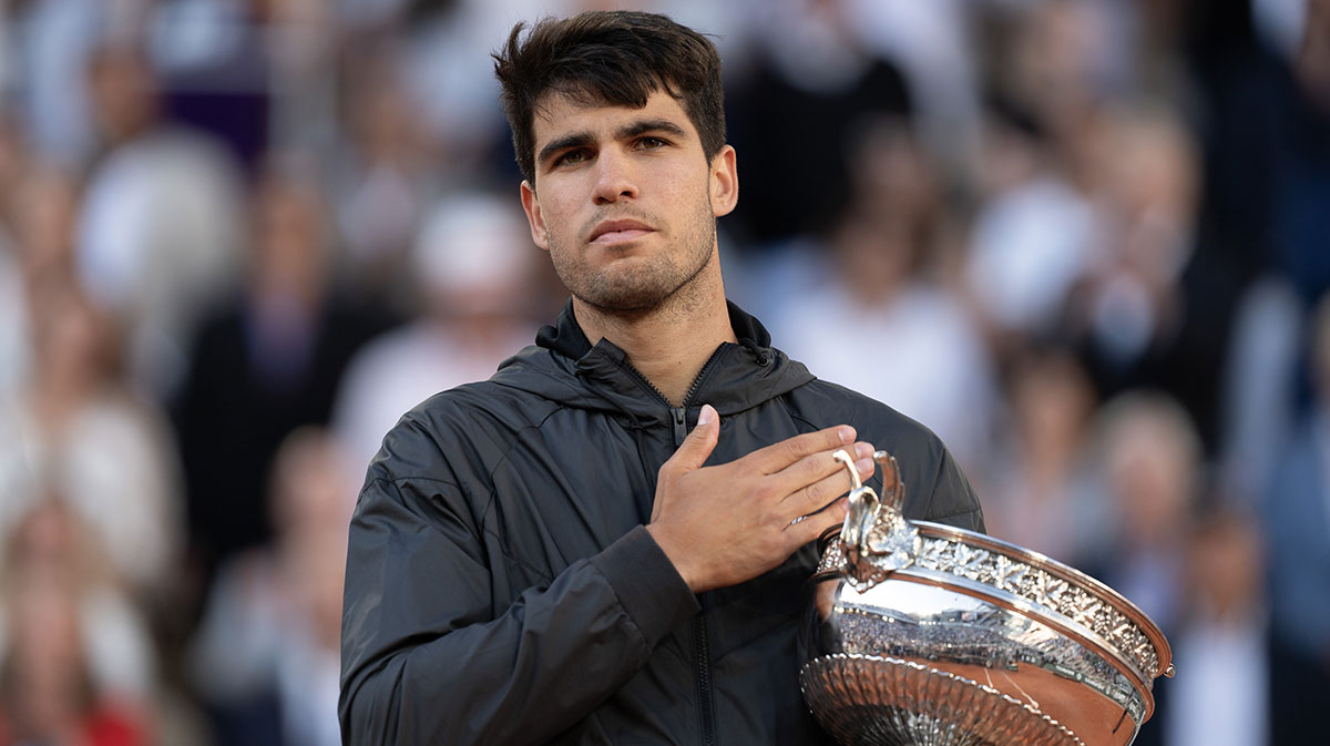 Carlos Alcaraz of Spain poses with the trophy after winning the men’s singles final against Alexander Zverev of Germany on day 15 of Roland Garros at Stade Roland Garros.